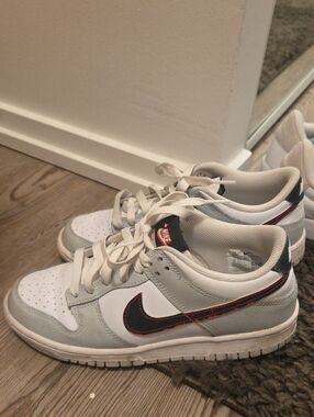 Nike Dunk Low Sneakers in White, Light Gray, Black & Red Accent
